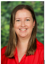 Portrait of Kristen Garrett Acting Principal smiling against a green background